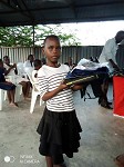 Student receiving school package donation
